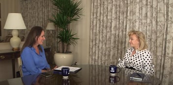 Muni Jensen and Blanca Treviño sitting at a table talking