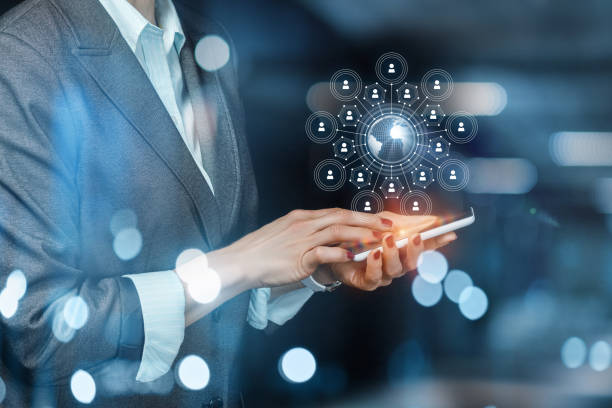  Business women on phone looking at global network. 